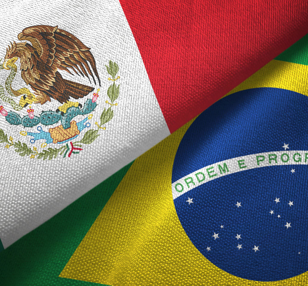 The two flags for Mexico and Brazil on textile cloth.
